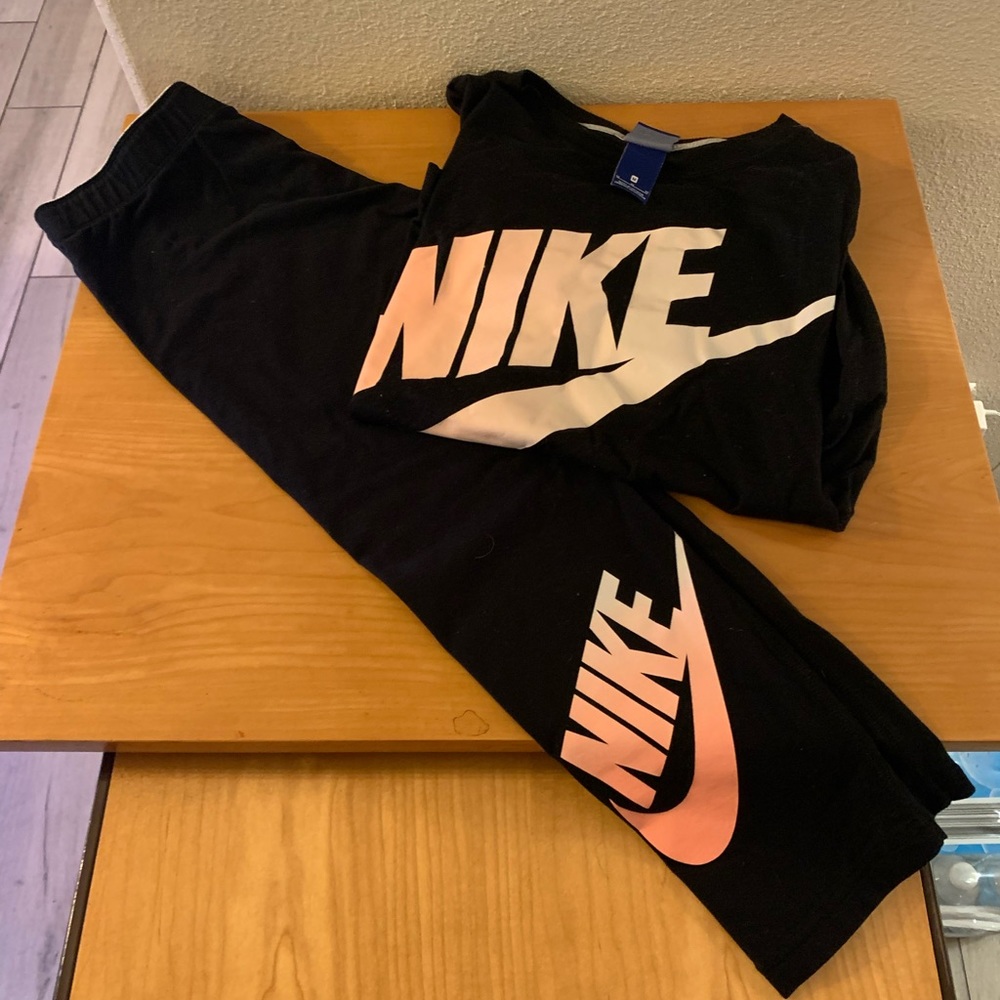 Nike pants and shirt both are cotton not the silky stuff.
